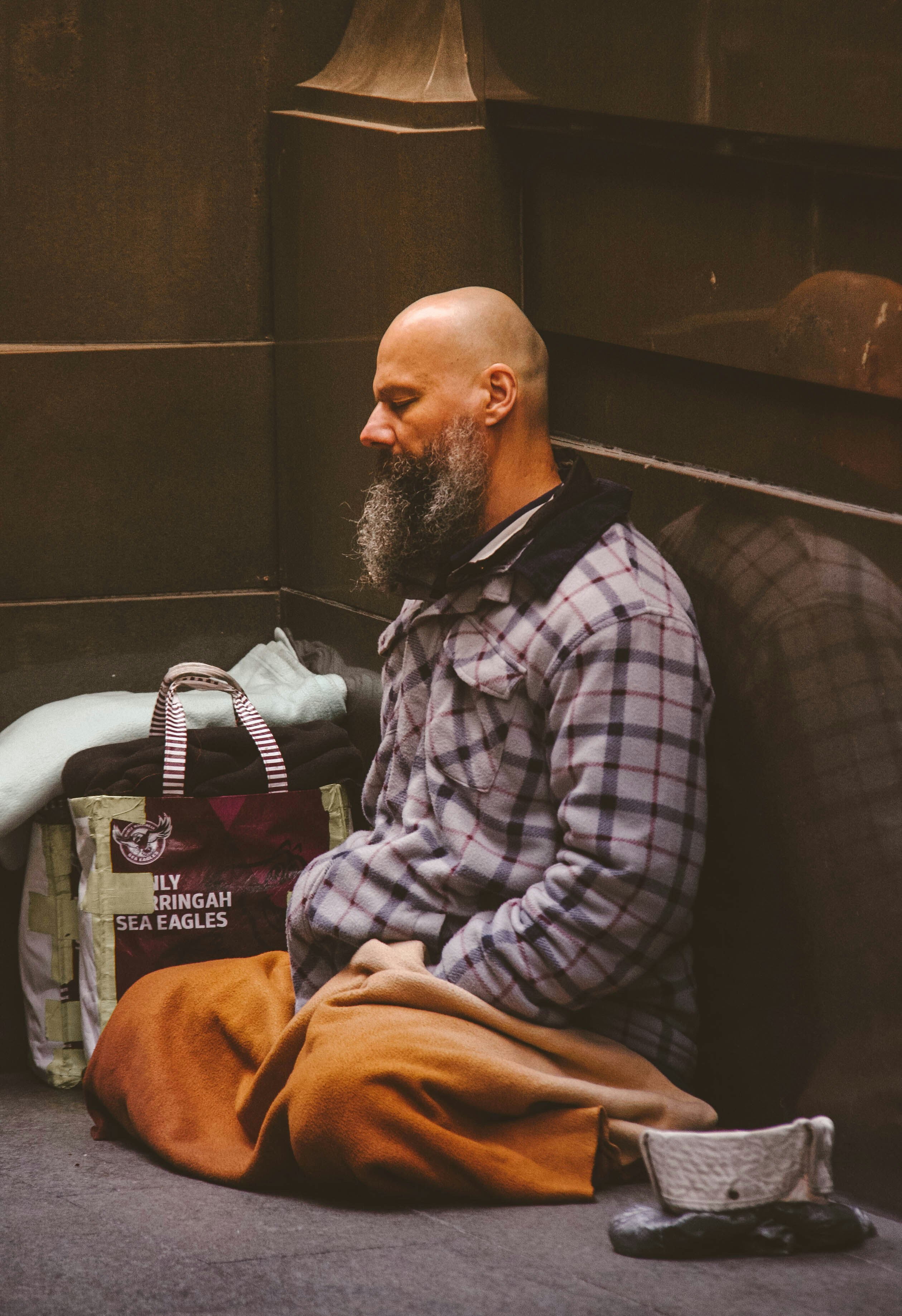 A thoughtful homeless individual